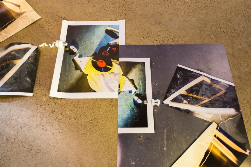 Ruins for Tomorrow, 2016 | Printed digital photographs, silk screen, canvas frame, vinyl records, video cassette, binoculars, surveillance camera, muslin, lamp stand, lantern, broken light bulb, and light kit 