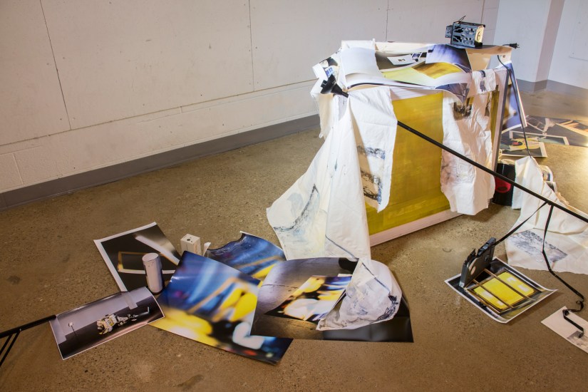 Ruins for Tomorrow, 2016 | Printed digital photographs, silk screen, canvas frame, vinyl records, video cassette, binoculars, surveillance camera, muslin, lamp stand, lantern, broken light bulb, and light kit